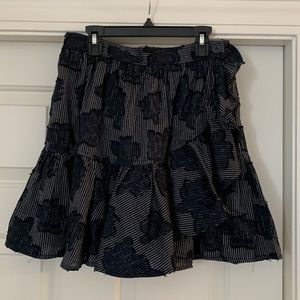 KOCH mini wrap skirt. Blue striped with flowers on it
